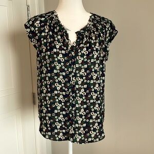 Floral, print sleeveless blouse, green, red and blue.